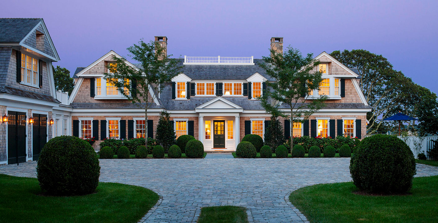 Shingle-style gambrel home with a widow's walk