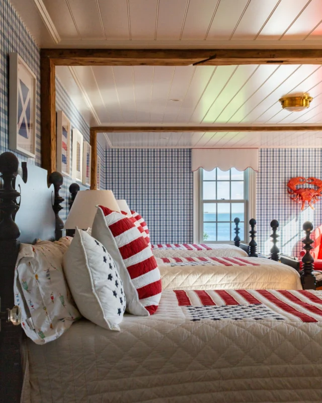 In Duxbury, beadboard ceilings and reclaimed wood beams accent an Americana-inspired waterfront bedroom. See more of this coastal treasure in the June/July issue of Ocean Home magazine.

Architecture: @patrickahearnarchitect 
Builder: @jbrobbiecustomhomes 
Interior Design: @hanlonwantuckdesign 
Photo Credit: @taylor.allegrini 
Publisher: @oceanhomemag