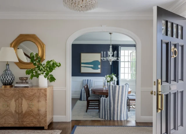 A gracious foyer sets the tone with tailored millwork and an arched opening that frames the dining room beyond. Thoughtful architectural details and a refined palette create a warm, welcoming arrival.

Architect: @patrickahearnarchitect
Builder: @thechelseacompany
Interior Design: @elementstyle
Photo Credit: @michaeljleephotography