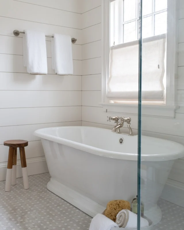 Nickel gap wall paneling lends a timeless air to the primary bathroom within this newly constructed home.

Architect: @patrickahearnarchitect
Builder: Burnham + Magnuson Builders
Interior Design: @karenbowinteriors
Photo Credit: @AmyVischio