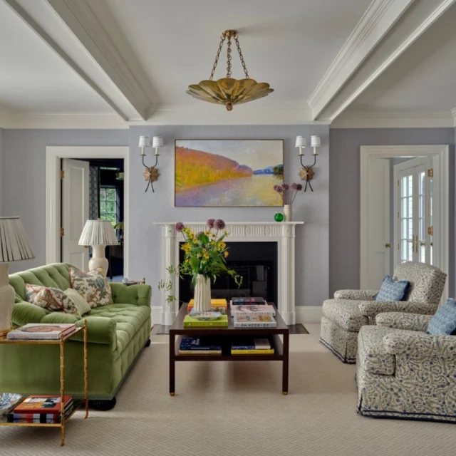 A wood-burning fireplace anchors the formal living room at this custom renovated Brookline, Mass, residence with cased beams overhead reinforcing its prominence.

Architecture: @patrickahearnarchitect
Builder: @falloncustomhomes
Interior Design: @annsleyinteriors
Photo Credit: @seanlitchfield
Stylist: @francesfinds