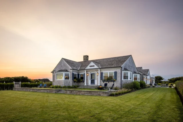 Overlooking Newport Country Club with views to the ocean and marsh, Ocean Lodge was raised to meet FEMA requirements, yet its front façade and stature remain virtually unchanged. Rather than erase the past, the renovation honors the home’s 1938 heritage, with a considered landscape preserving its timeless relationship to the land.

Architecture: @patrickahearnarchitect
Landscape: @dangordonla
Builder: @pcciri
Interior Design: @tastedesigninc
Photo Credit: @crucinski_
