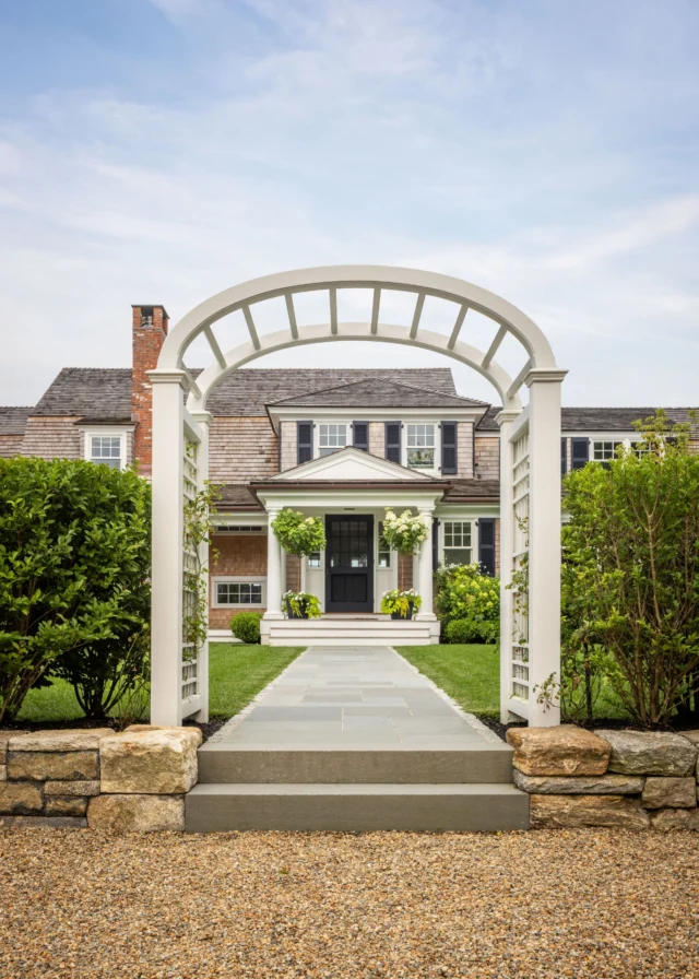 In Edgartown, a break in the privet hedge marked by a traditional arched arbor welcomes visitors to this renovated historic home. 

Architecture: @patrickahearnarchitect
Builder: @rosbeckbuilders 
Photo Credit: @crucinski_
