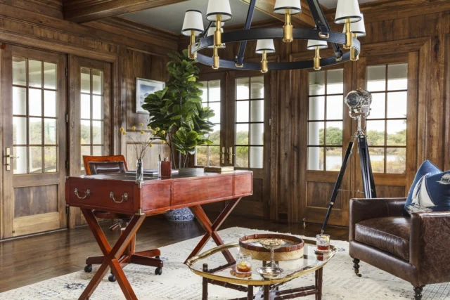 A handsome paneled library within this newly built residence offers water views just beyond its walls. See more of the home in Patrick's forthcoming book Driven: The Road to Iconic Design available for preorder at the link in our bio.​​​​​​​​
​​​​​​​​
Architecture: @patrickahearnarchitect​​​​​​​​
Builder: @colonial_reproductions​​​​​​​​
Interior Design: @trackerhomedecor​​​​​​​​
Photo Credit: @gregpremru​​​​​​​​
Styling: @cmack2002
