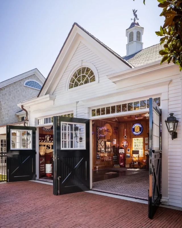 Layers of historically-inspired detail at this newly built carriage house - including a herringbone brick floor, spar varnished interior beadboard paneling, and a reclaimed cupola - leave passersby wondering whether the structure could have stood forever. See more of this project and the automobilia it holds in Patrick's forthcoming book Driven: The Road to Iconic Design. Preorder via the link in our bio.

Architecture: @patrickahearnarchitect 
Photo Credit: @crucinski_