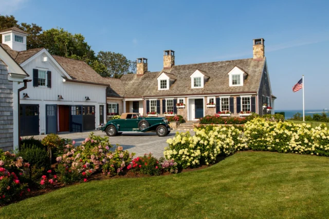 Classicism is on display in North Chatham, where this newly built home features all the expected detail and scale of a traditional cape house. What could have been a barn attached to the residence over time houses a handsome carriage house below and guest quarters above. See more of the home and this prized 1936 Duesenberg in Patrick's forthcoming book Driven: The Road to Iconic Design, available for preorder via the link in our bio.

Architecture: @patrickahearnarchitect
Builder: @spencerandcompany
Landscape: @dangordonla
Photo Credit: @taylor.allegrini