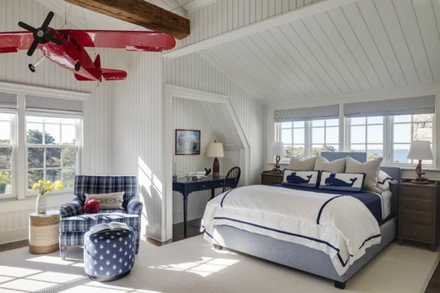 With views of Edgartown’s Great Pond in the distance, this Martha’s Vineyard bedroom features significant volume thanks to the home’s gambrel roofline.  See more of the residence in Patrick’s forthcoming book Driven: The Road to Iconic Design, available for preorder via the link in our bio.
⠀⠀⠀⠀⠀⠀⠀⠀⠀
Architecture: @patrickahearnarchitect
Builder: @colonial_reproductions
Interior Design: @trackerhomedecor
Photo Credit: @gregpremru
Styling: @cmack2002