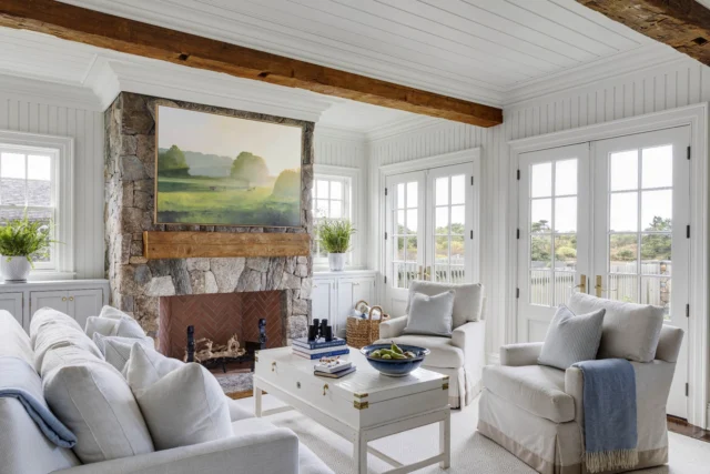 Within this newly built legacy property overlooking Edgartown's Great Pond, the kitchen and family room are a study in timeless architectural detail. Classical beadboard, reclaimed beams, New England fieldstone, and thick crown molding, window casings, and built-ins provide a historically-inspired backdrop upon which comfortable interiors are layered.

Architecture: @patrickahearnarchitect
Builder: @colonial_reproductions
Interior Design: @trackerhomedecor
Photo Credit: @gregpremru
Styling: @cmack2002