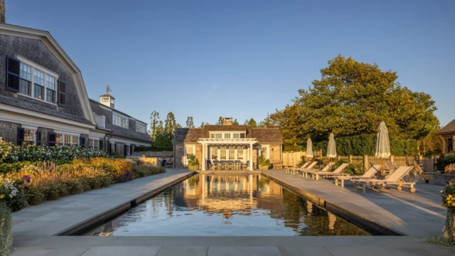 At golden hour, this custom cabana sited along Slough Cove is reflected in the water of the adjacent aquatic program. See more of the property in Patrick's forthcoming book Driven: The Road to Iconic Design, available for preorder at the link in our bio.

Architecture: @patrickahearnarchitect
Builder: @colonial_reproductions
Landscape: Peggy Schweir
Photo Credit: @crucinski_
