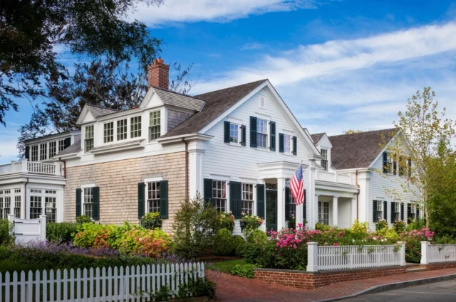 The owners of the 1845 Captain Consider Fisher House wanted to restore and reimagine their Greek Revival property as a vacation home that would feel intimate but ready for entertaining. To accommodate their expansive program, a historically appropriate second gabled structure was added, connected to the original by a glass-enclosed breezeway-like dining pavilion.

Architecture: @Patrickahearnarchitect
Builder: @colonial_reproductions 
Landscape: Peggy Schwier Gardens
Photo Credit: @gregpremru