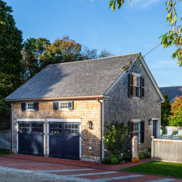 The carriage house at this Vineyard property serves a myriad of functions on site - it allows for parking and vehicle storage in bustling Edgartown while providing pool cabana functionality on the opposite side. In addition, the structure helps shield the backyard program from street view.

Architecture: @patrickahearnarchitect
Builder: Burnham & Magneson
Interior Designer: @karenbowinteriors 
Photo Credit: @taylor.allegrini