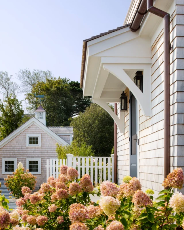 At this Chatham Greek Revival, a carriage house across from the family entrance adds to the traditional composition. Topped with a cupola and character-rich weathervane, it is a destination of its own on the property.

Architecture: @patrickahearnarchitect⠀⠀⠀⠀⠀⠀
Builder: @whitlabrothersbuilders
Interior Designer: @digsdesignco
Landscape: Copper Moon Landscaping
Photo Credit: @gregpremru